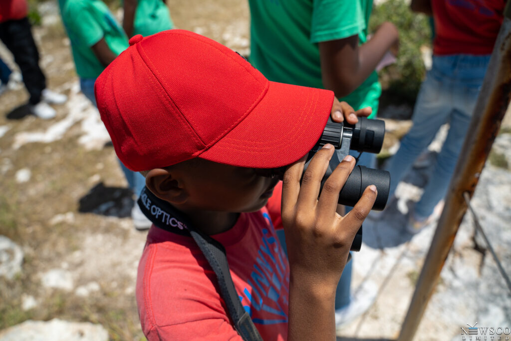 9 student uses binoculars on great bird island. credits chaso media (1)