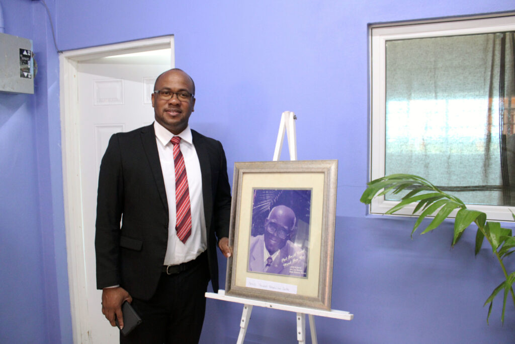 rawdon turner with a photo of the late denis bowers